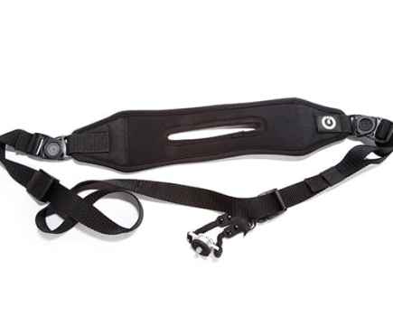 Black camera strap with a white background