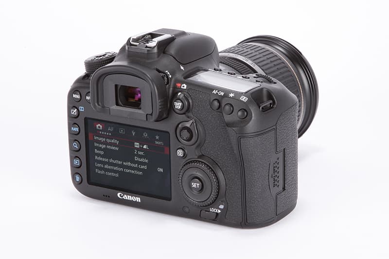 Canon EOS 5D Mark II rear, slant view with LCD displaying menu settings
