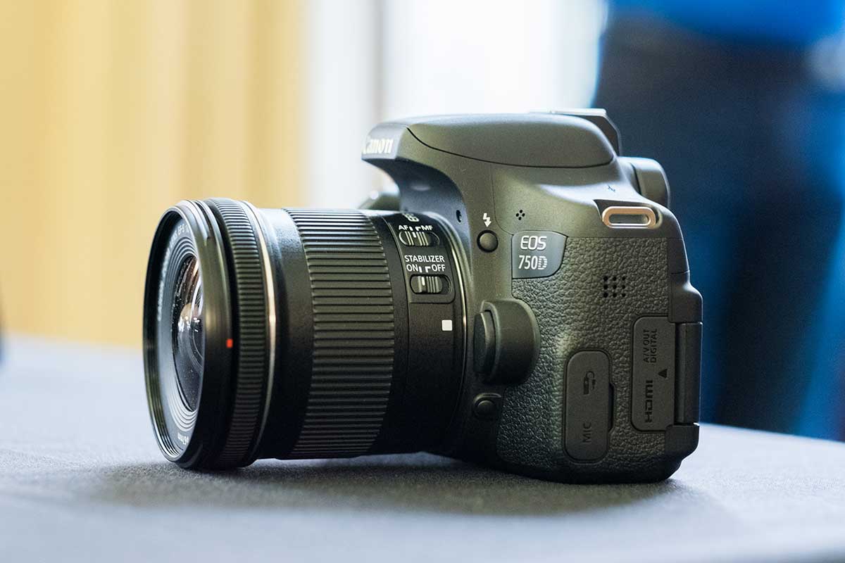 The Canon EOS 750D viewed from the side, with lens attached
