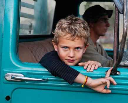 A farmer's son in his father's truck, Steve McCurry