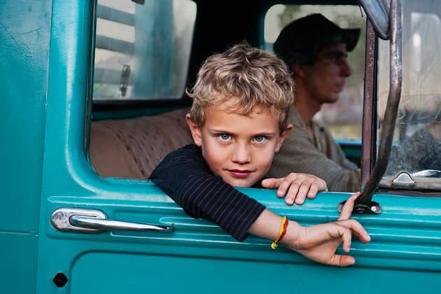 A farmer's son in his father's truck, Steve McCurry