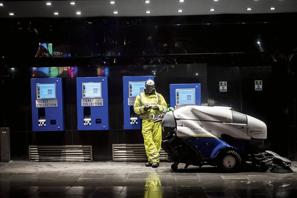 As the rest of us sleep, a street cleaner works  the roads around Piccadilly Circus in London