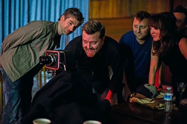 Guy Garvey (centre) looks at footage of his latest music video with director Mark Thomas (far left)
