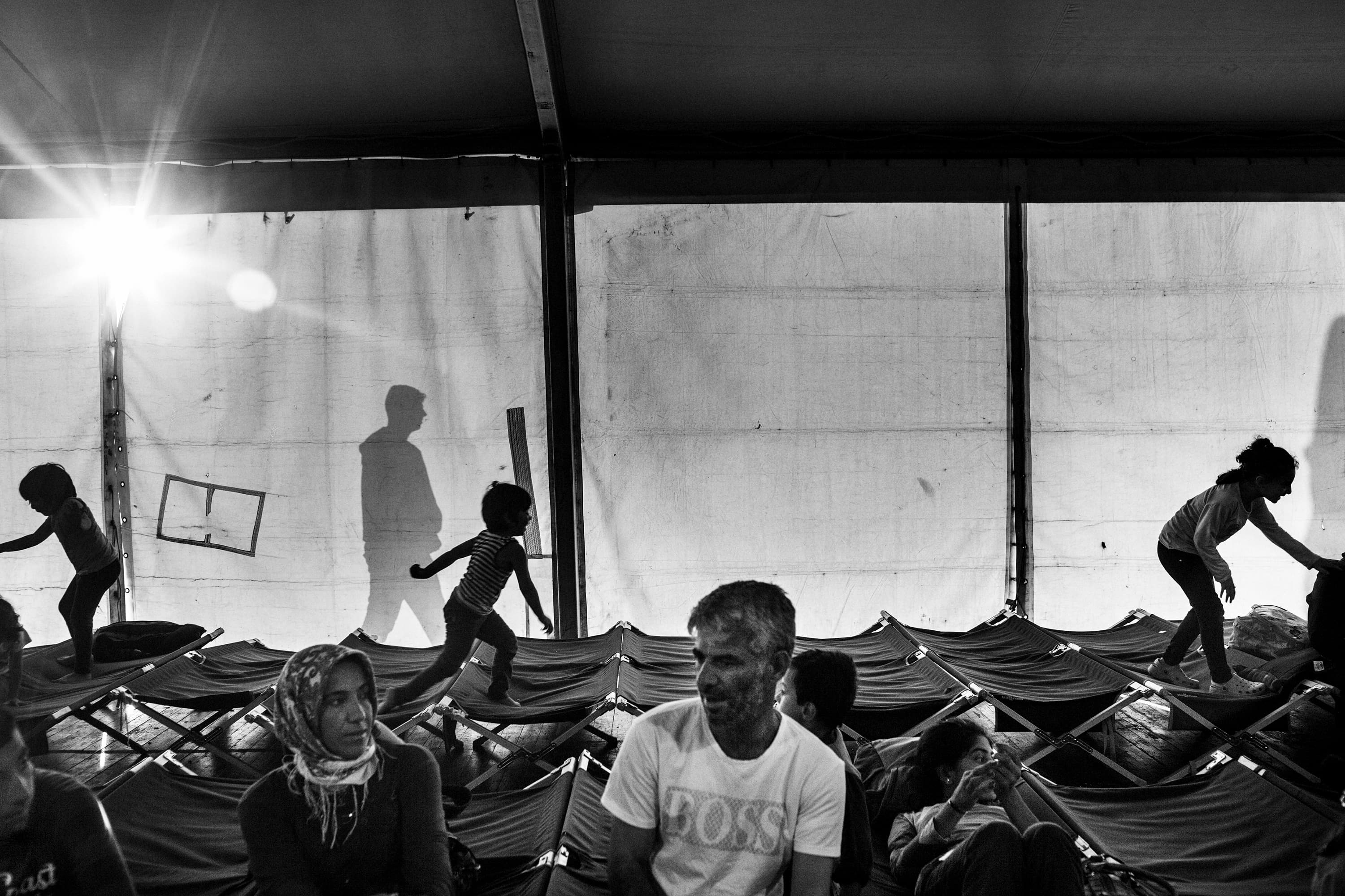 Syrian refugee children play in the reception tent at the dock of the city of Augusta (Italy) after having been registered by the Italian authorities on June 10, 2015. On June 10th 2015, 210 Syrian refugees disembarked at the Sicilian port of Augusta. They left from Mersin in Turkey and spent five days at sea without food or water before being rescued by the Belgian navy. The number of refugees and migrants taking the dangerous journey across the Mediterranean to Europe, fleeing war, hunger and persecution, is increasing more and more. According to UNHCR's data, more than 1,000,000 arrivals by sea were registered in 2015 in Europe