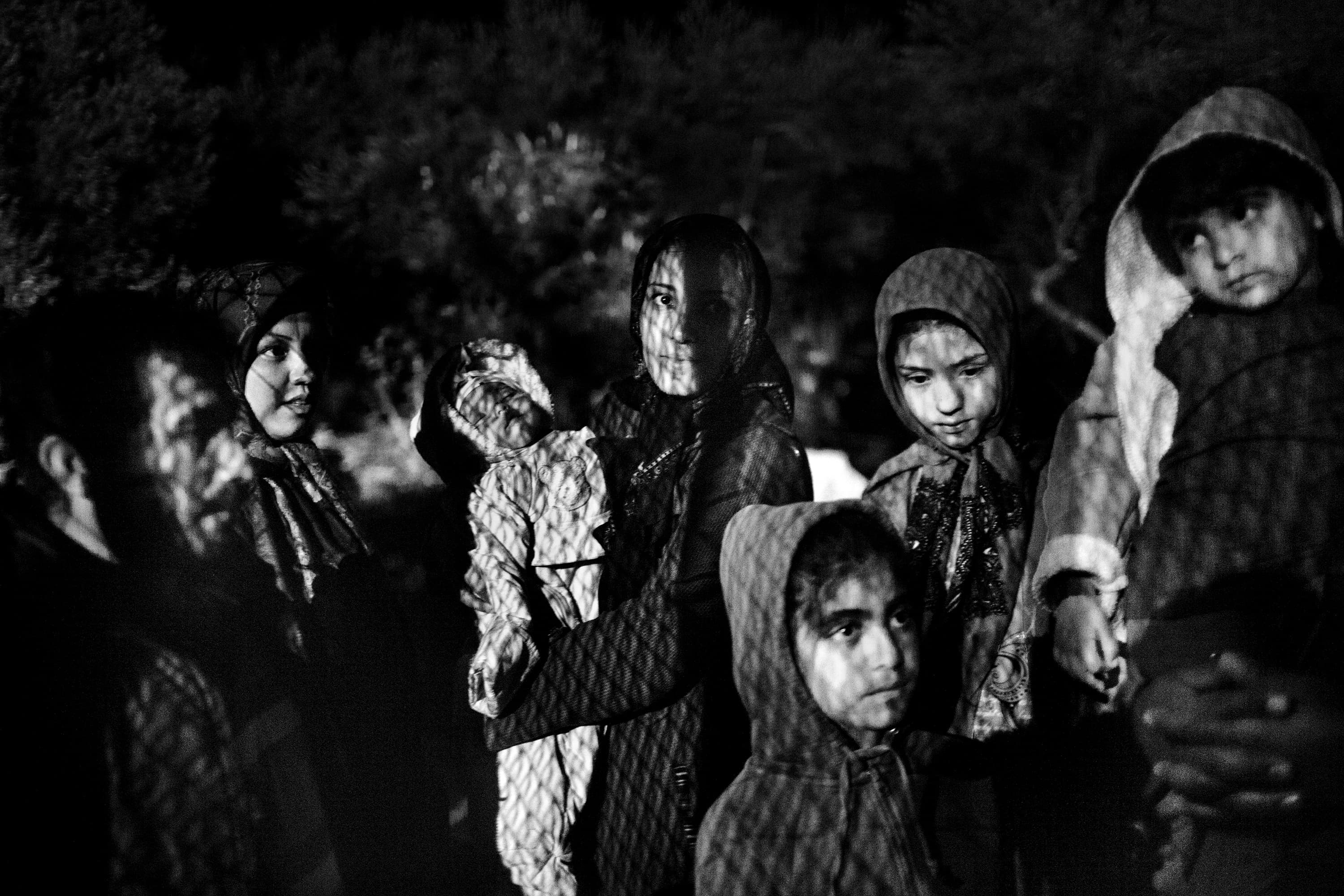 Afghan refugees wait to be registered out of Moria camp at the Greek island of Lesvos on October 12, 2015. Thousand of refugees, mostly coming from Syria, Iraq and Afghanistan, cross everyday the Aegean sea from Turkey to reach Europe: a relatively short but extremely perilous journey. According to the UN Refugee Agency, more than 850000 arrivals by sea were registered in Greece in 2015.
