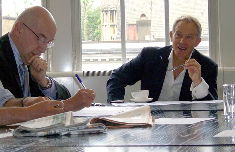 Tony Blair in the Evening Standard morning editorial conference with Picture Editor David Ofield (left)