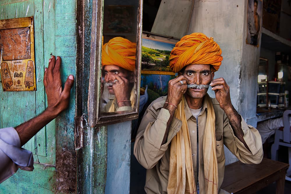 Steve McCurry Rajasthan 2009. Man in orange turban