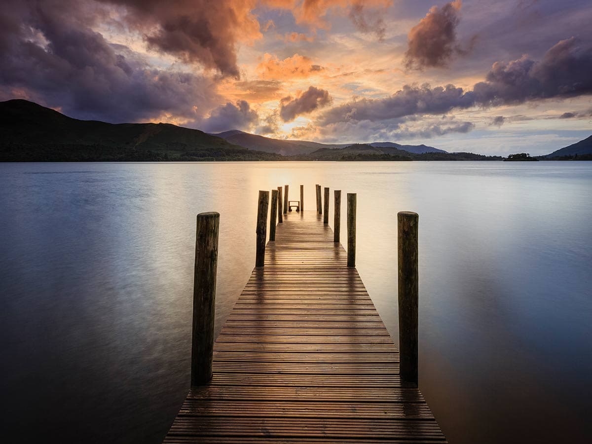 When there is no foreground object particularly close to the camera, focusing about a third of the way into the scene - in this case, just in front of the second set of posts on the jetty - will give you all the depth of field you need in a landscape