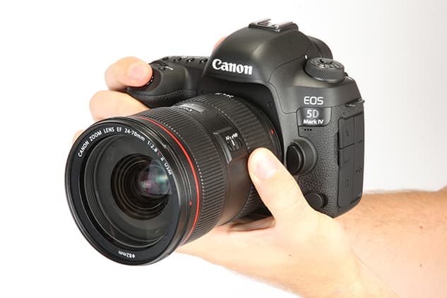 Canon 5D Mark IV with Canon 24-70 f/2.8 lens in hand