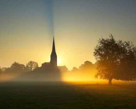 Outdoor light sun rising behind Salisbury Cathedral