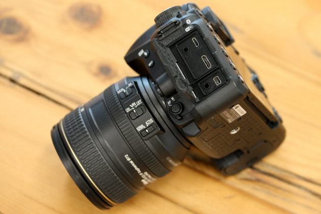 Nikon D7500 with AF-S 18-140mm F/3.5-5.6G ED VR kit Lens, side view of connection ports