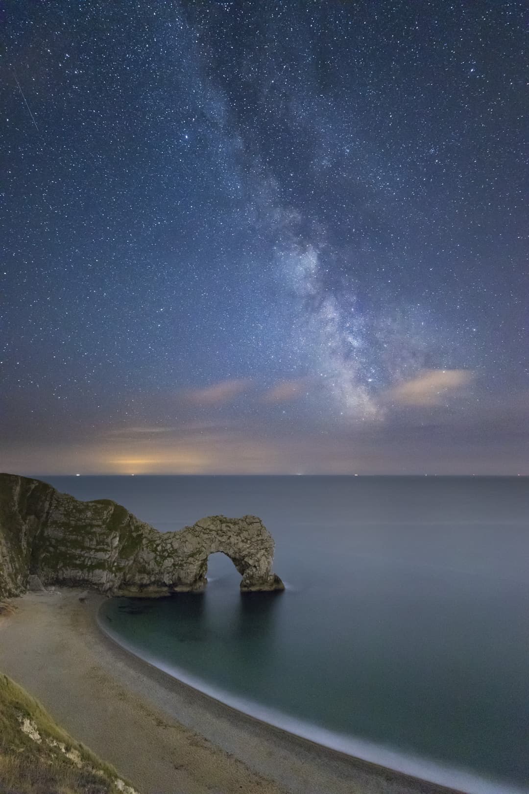 The Milky Way over Durdle Door, Jurassic Coast, Dorset, England, UK