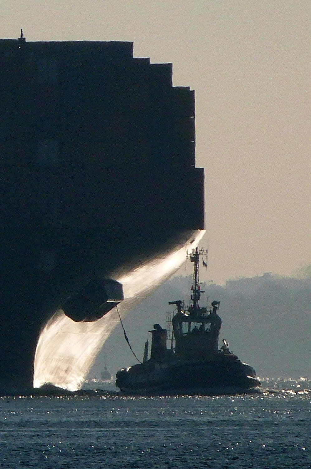 The winning image. Lord Greenway's atmospheric backlit mage of a tugboat and cargo ship was the unanimous favourite of the judges