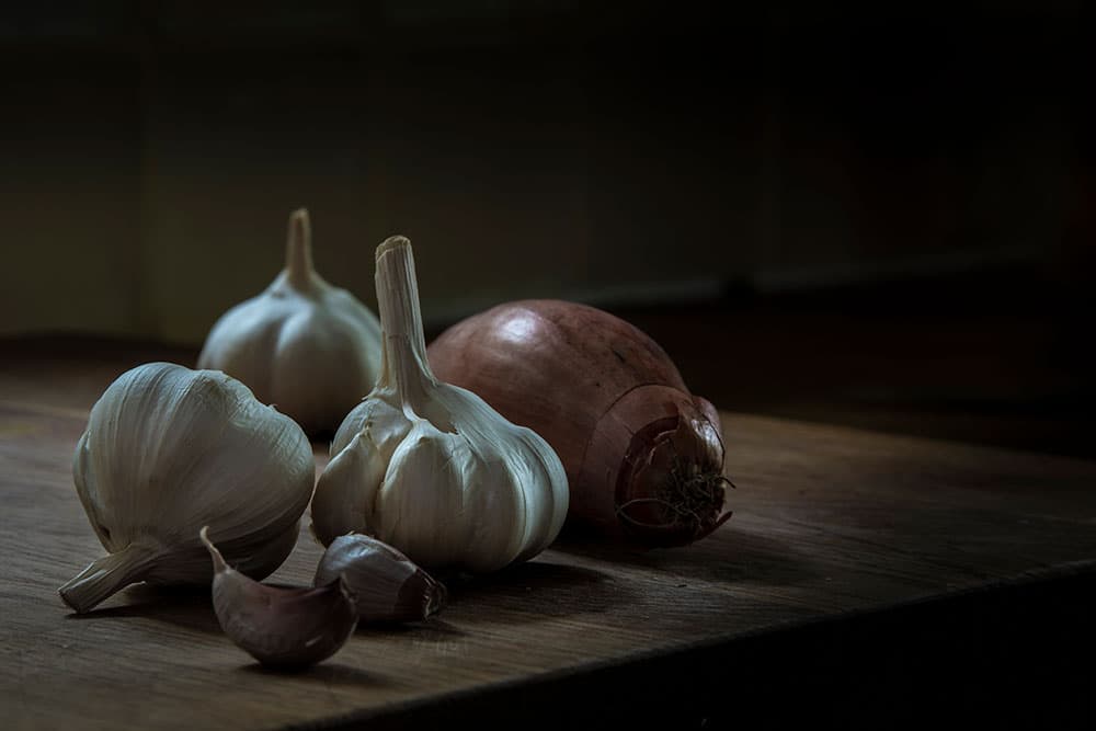 Harmonious colour temperature before bulbs of garlic continuous lighting still life