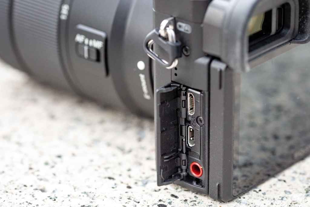 Sony A6400, hinged door on the side with various connection ports