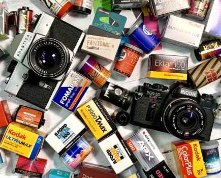 Aerial view of two cameras within a selection of film casings