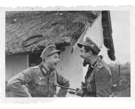 Black and white photograph of two german soilders in WW2 laughing