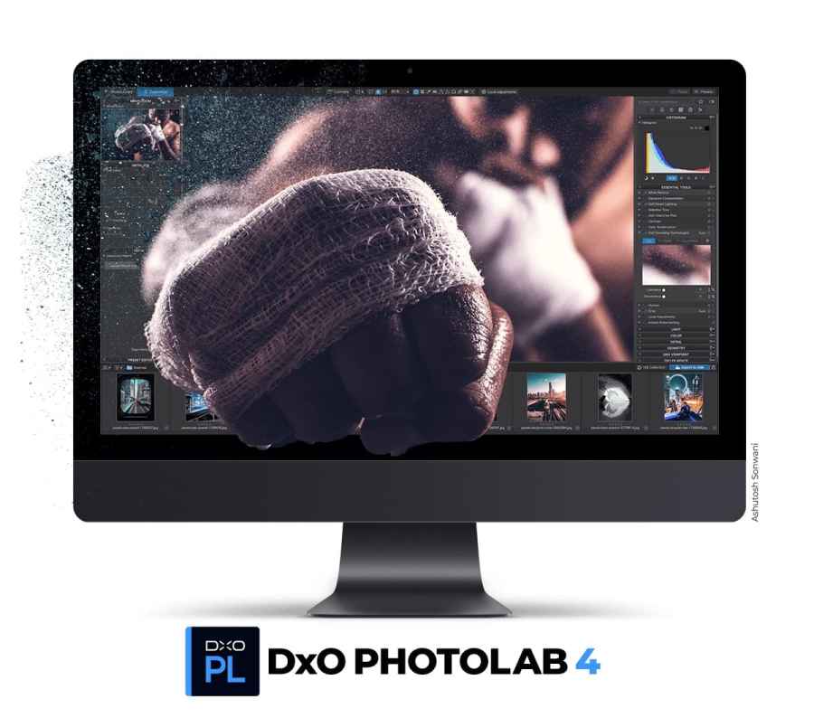 Apple computer with an image of boxer punching that appears to come out of the screen