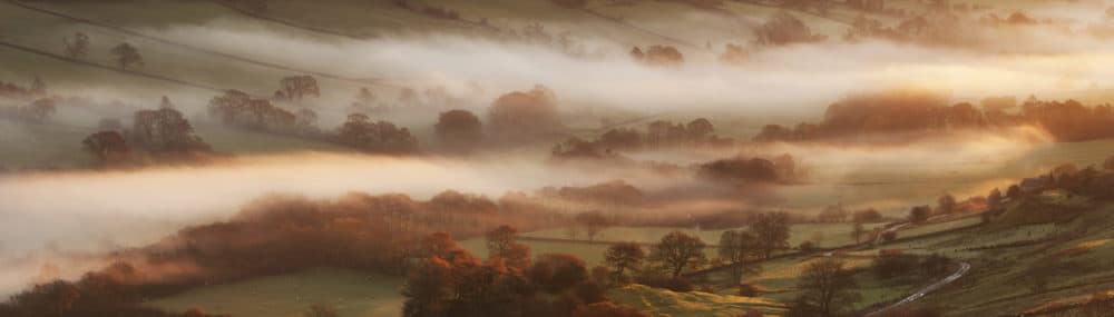 Mist filled valley at sunrise in autumn.Yorkshire, England. 