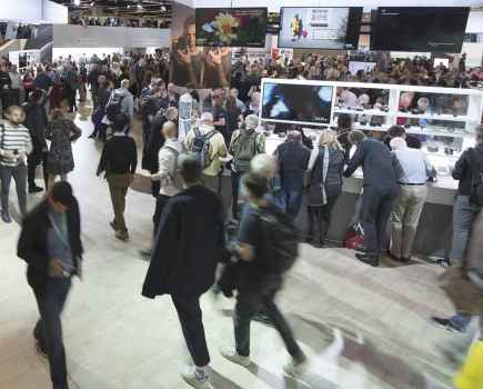 Guests walking around inside the Photokina photography event
