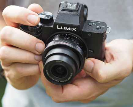 Panasonic Lumix G100 in hand