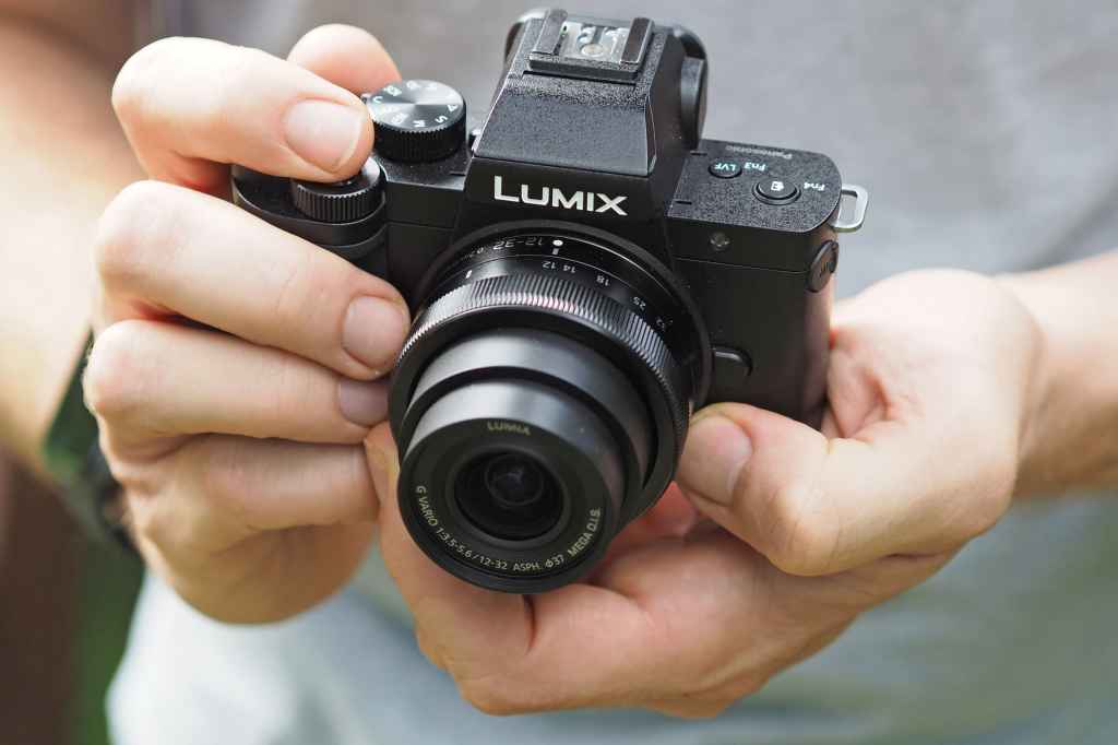 Panasonic Lumix G100 in hand