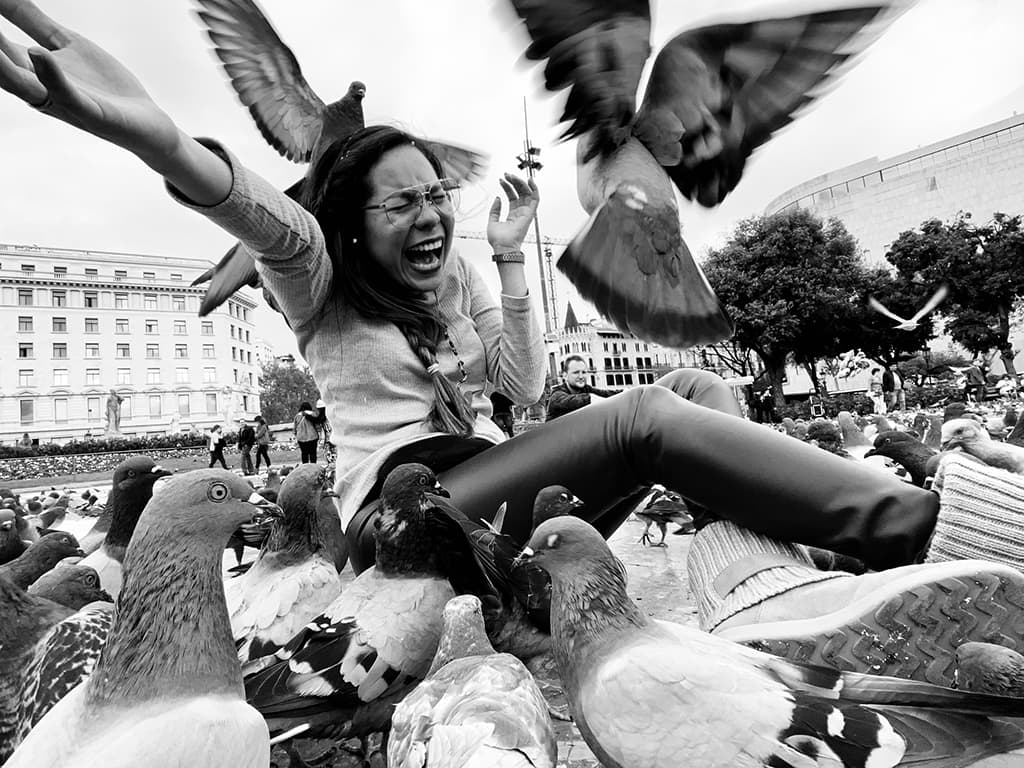 street photograph with smartphone woman and pigeons