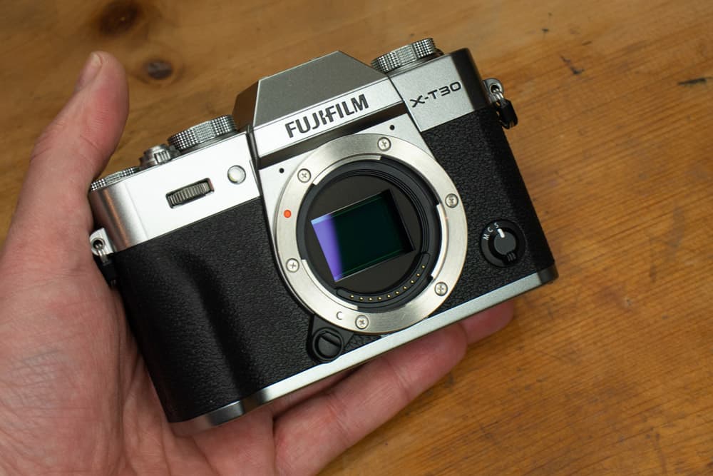 Best cameras for portraits Fujifilm X-T30 Mark II in hand, JW