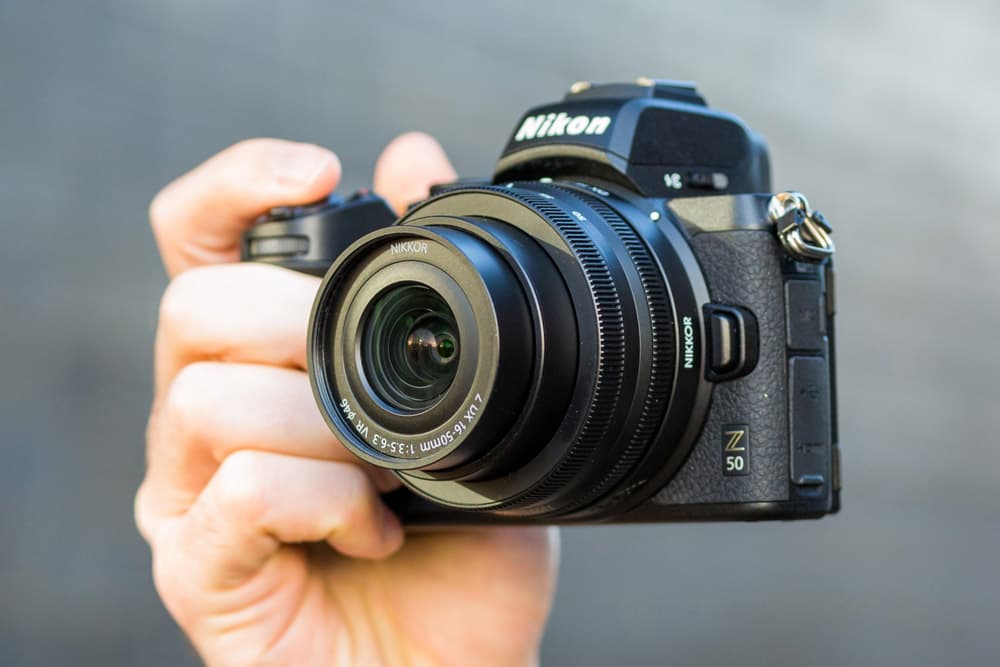 Nikon Z50 in hand with lens, Photo: Michael Topham