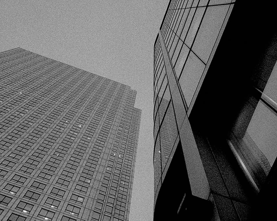 pointing up at two sky scrapers