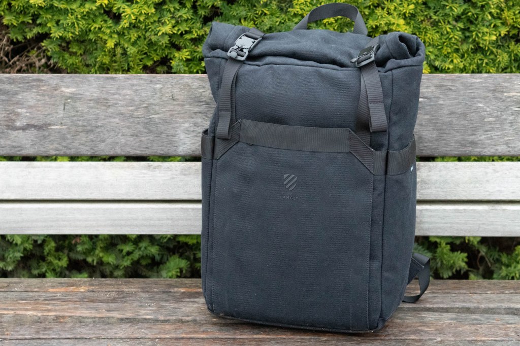 Langly Weekender Backpack on a wooden bench