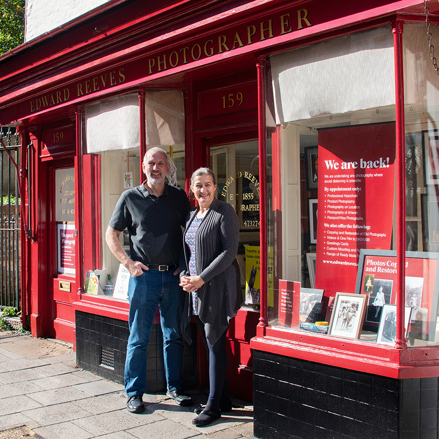 The Reeves family’s fourth-generation photographer, Tom Reeves and his wife Tania, outside the Edward Reeves Studio in Lewes. 