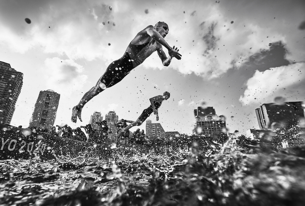Take-Off! Jonas Schomburg of Germany takes off as he dives into the water during the men's triathlon on 26 July 2021 at the Tokyo 2020 Olympics. © Adam Pretty, Australia, Finalist, Professional, Sport, 2022 Sony World Photography Awards