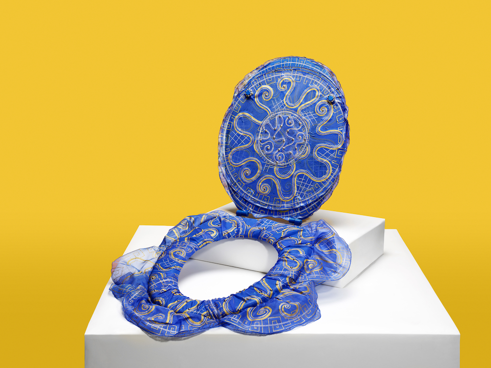 Dame Zandra Rhodes' toilet seat design features one of her archive prints ‘Chinese Water Circles’ on silk, draped over the seat to emulate water. Image: © RANKIN/WaterAid