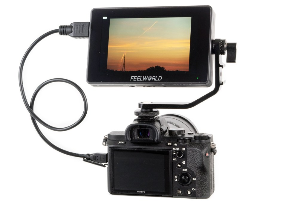 Feelworld F6 Plus field monitor mounted on a Sony camera