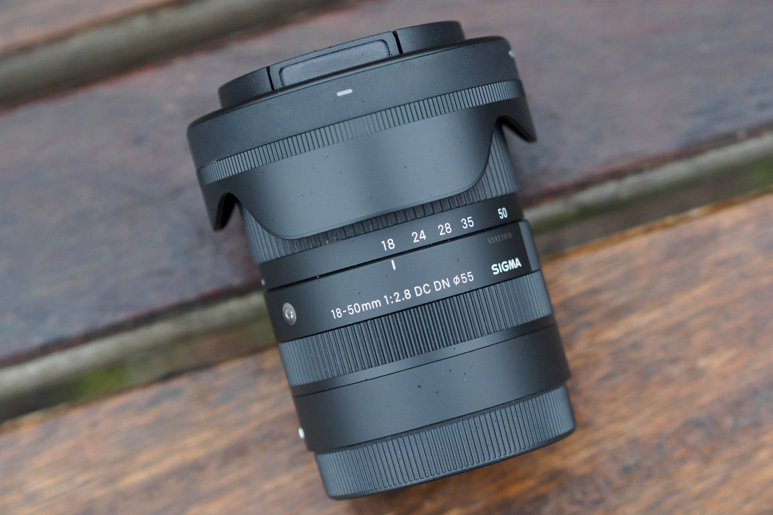 Sigma 18-50mm F2.8 DC DN with caps and hood reversed