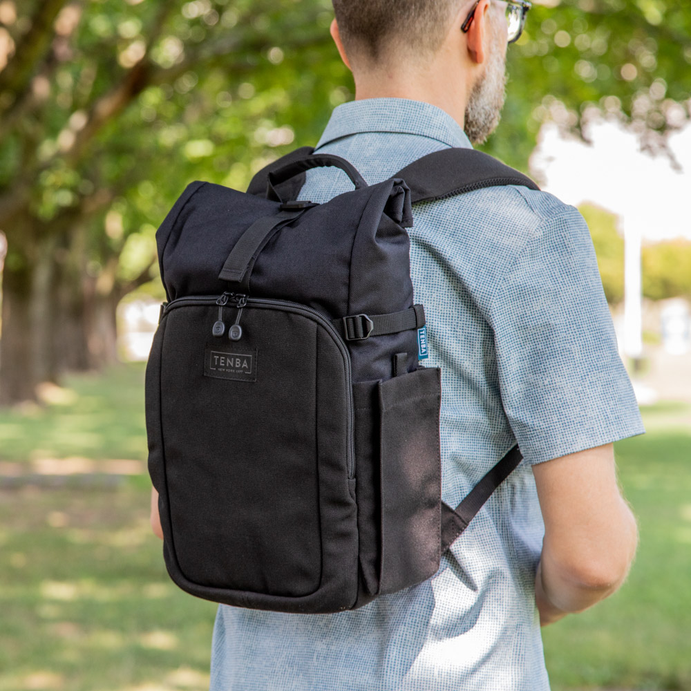 A Tenba Fulton V2 black backpack being worn