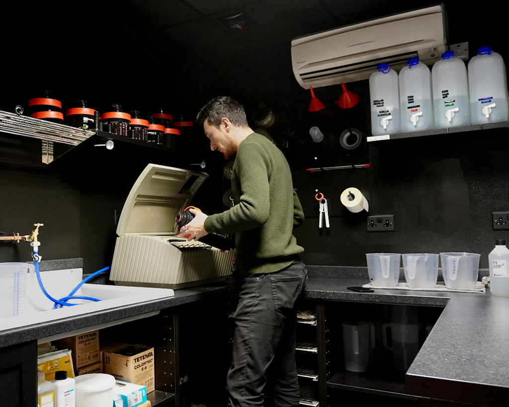 Sebastian setting up to process in the darkroom