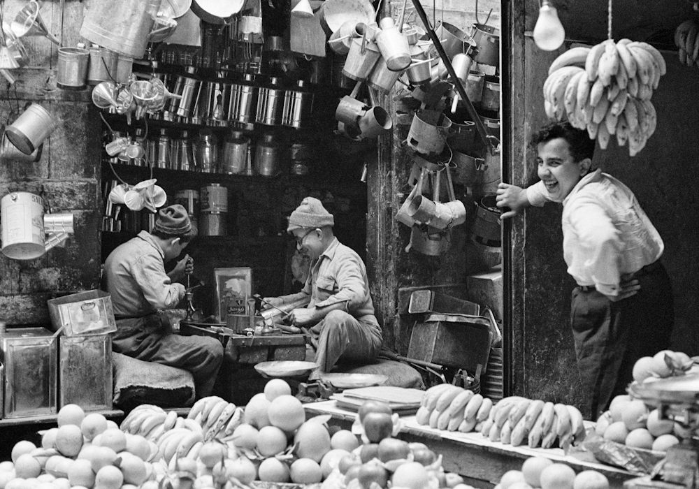 Fruit seller and tinsmith, market in Tripoli, Lebanon, 1960. © Marilyn Stafford
