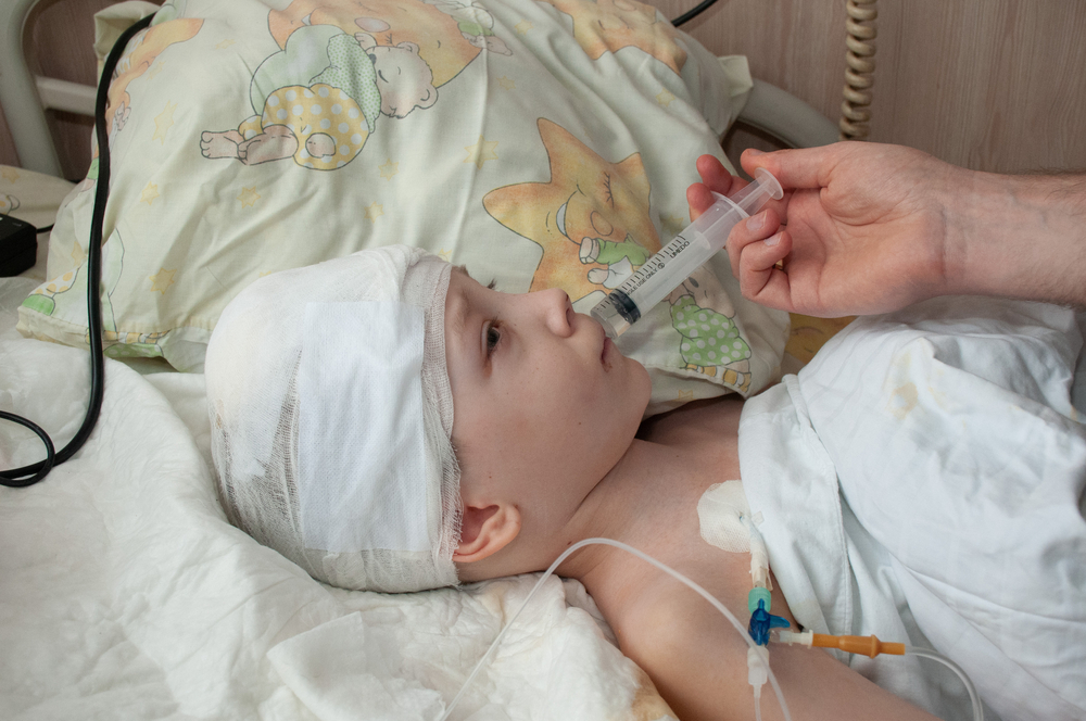 A seven-year-old boy, Vova, who was injured by shelling, in hospital in Kharkiv, Ukraine, 10 March 2022. Photo by Fotoreserg, courtesy Deposit Photos 