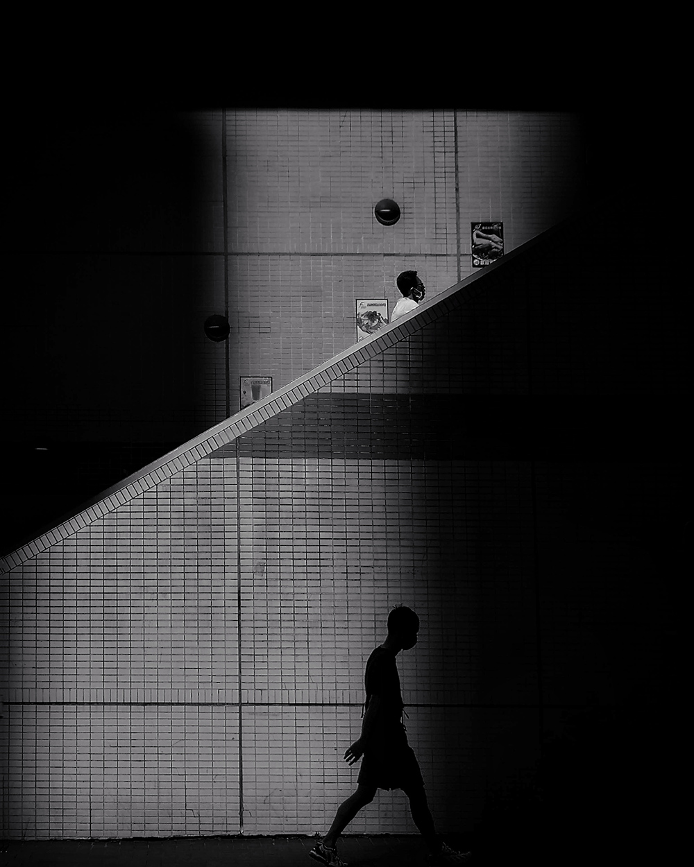 Same time! by Wai Ying Kwok, 1st Place Winner, Darkness|Noir category, 2021 Mobile Photography Awards. © Wai Ying Kwok