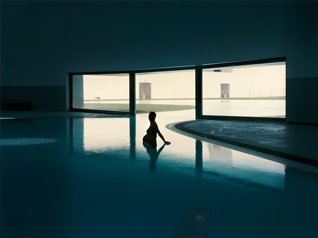 pregnant woman in a pool silhouette by hannah starkey