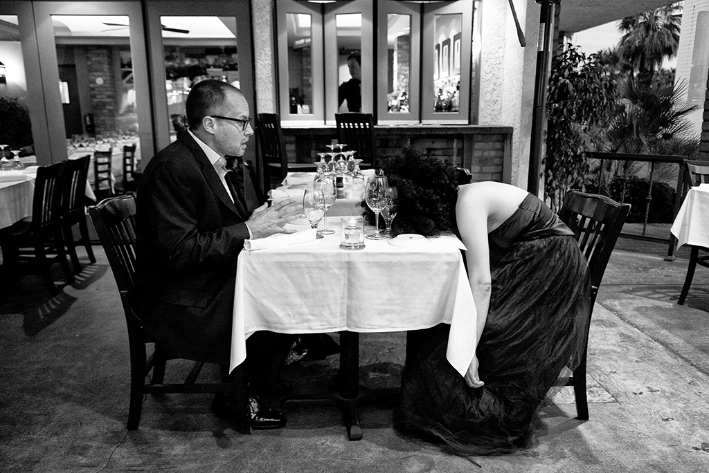 black and white picture of woman and man at dinner