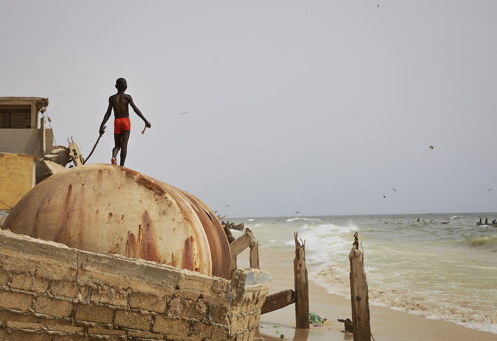 A child plays on the ruins of a sea wall after the ocean surge, Saint Louis, Senegal. © Nicky Quamina-Woo, winner Marilyn Stafford FotoReportage Award 2020