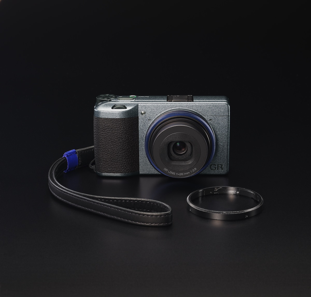 The Ricoh GR IIIx Urban Edition shown with leather strap and hotshoe cover