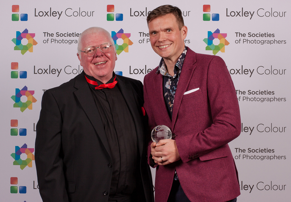 Phil Jones (left), The Societies of Photographers’ Director, presents James Musselwhite FSWPP (left) with the Photographer of the Year 2021 Award