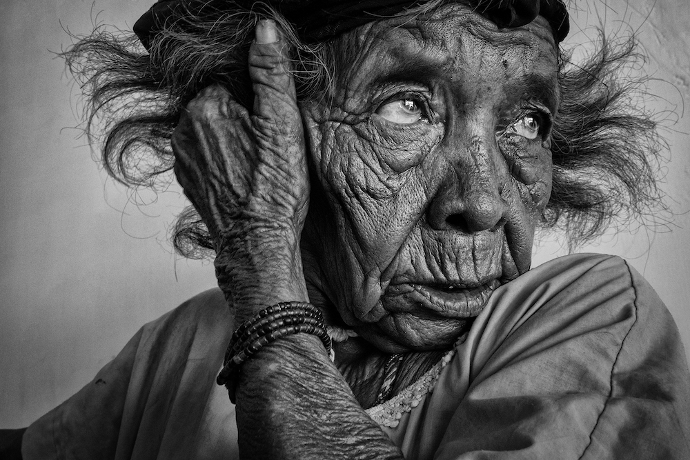 An old woman from the Wayuu people in La Guajiara, the very north of Colombia, shows a face that has seen many years of hard work - winner, Monochromal category, TPOTY 2014. © Johnny Haglund/www.tpoty.com