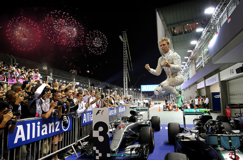 Formula 1 Special Merit 2021: Mercedes driver Nico Rosberg of Germany jumps off his car as he celebrates after winning the Singapore Formula One Grand Prix on the Marina Bay City Circuit Singapore, Sunday, 18 September 2016. © Yong Teck Lim/AP Photo