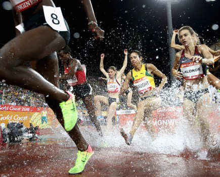Aisha Praught of Jamaica and Genevieve Lalonde of Canada clear the water jump competes in the Women's 3000 metres Steeplechase final during athletics on day seven of the Gold Coast 2018 Commonwealth Games at Carrara Stadium, Gold Coast, Australia, on 11 April 2018. © Cameron Spencer/Getty Images