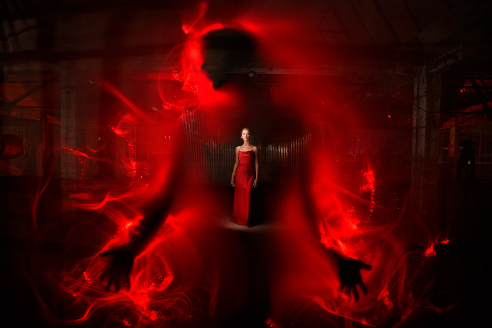 Veronica in Red – collaboration with Phill Fisher. ‘Created using a white sheet, black fibre optic attachment with adaptor and red filter and portrait scanner, with lightpainter torch by Lightpainting Paradise’. Image: Kim von Coels